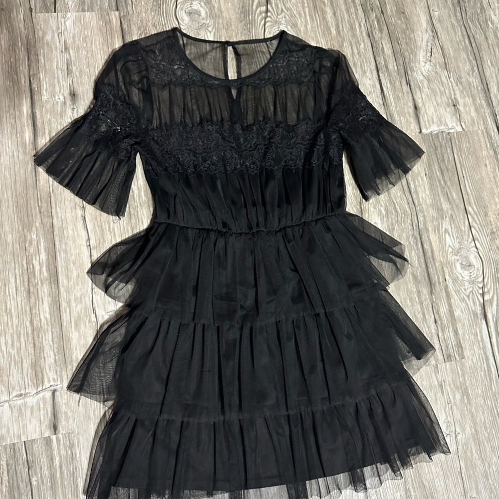 black ruffle dress fits a large or medium, high quality worn once